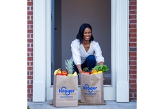 Image A woman getting Kroger groceries delivered.
